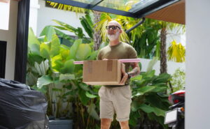 man walking through glass Veranda